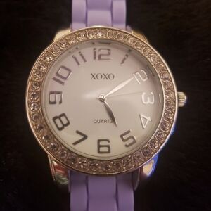 XOXO Watch with purple rubber wristband.